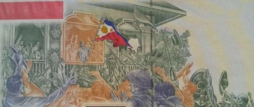 Ang proklamasyon ng Kasarinlan ng Pilipinas noong June 12, 1898. Mula sa 100,000 pisong perang papel na inilabas ng Bangko Sentral para sa Sentenaryo ng Kasarinlan noong 1998.