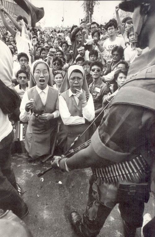 Iconic Pete Reyes photograph which captured the highlight of the 1986 People Power Revolution, when the Pro-Marcos Marine tanks under Gen. Artemio Tadiar were peacefully stopped by the people from attacking the rebel forces at Ortigas Ave. cor EDSA.
