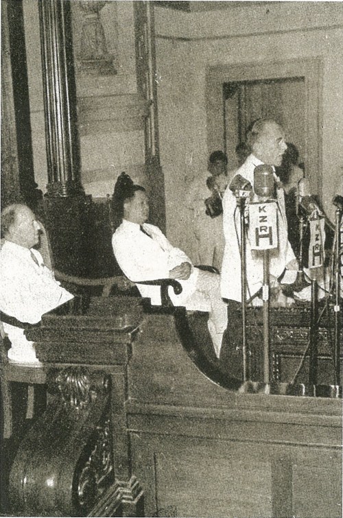 Fom gov.ph: President Manuel L. Quezon delivers his 1940 message to the National Assembly in front of its Speaker Jose Yulo and United States High Commissioner Francis B. Sayre.