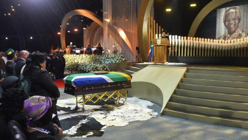 NOW HAPPENING AS I BLOG:  Family members stand near former South African President Nelson Mandela's casket during his funeral service in Qunu, South Africa, Dec. 15, 2013.  Associated Press.